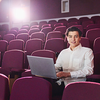 Seif in a lecture theatre