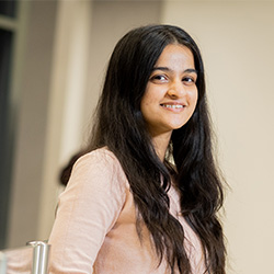 A student smiling at the camera