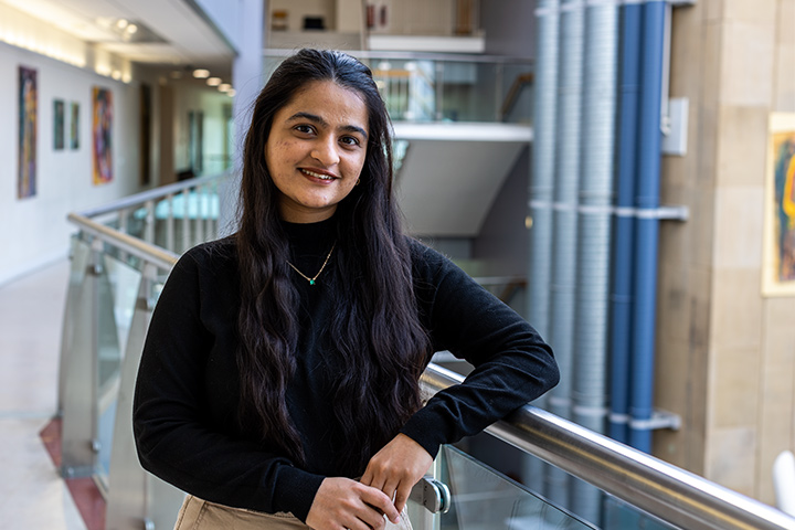 A student smiling at the camera