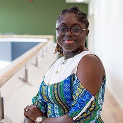 A student smiling at the camera