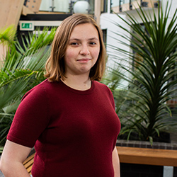 A student smiling at the camera