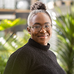 A student smiling at the camera