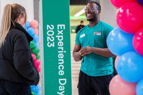 Two students chatting at an Experience Day.