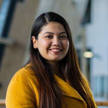 A student smiling at the camera