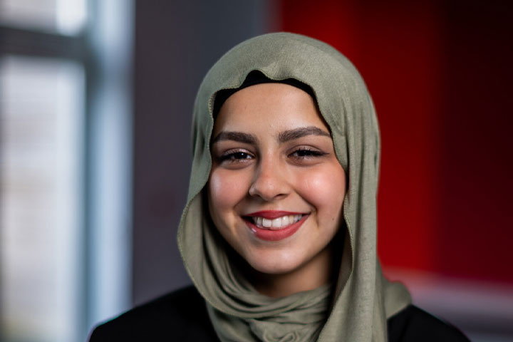 A student looking at the camera with a smile