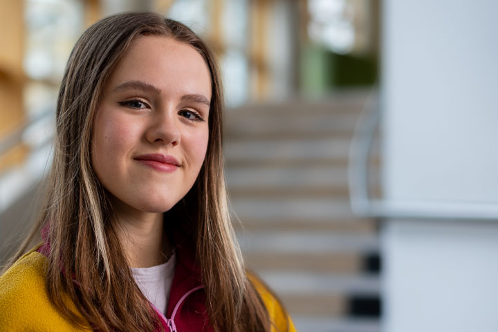 A student looking sideways towards camera