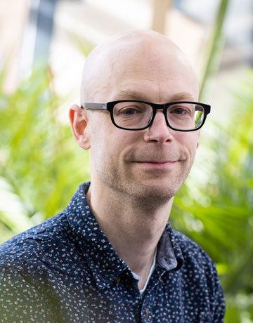 A student with a slight smile facing the camera