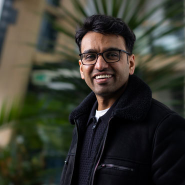 A student smiling at the camera