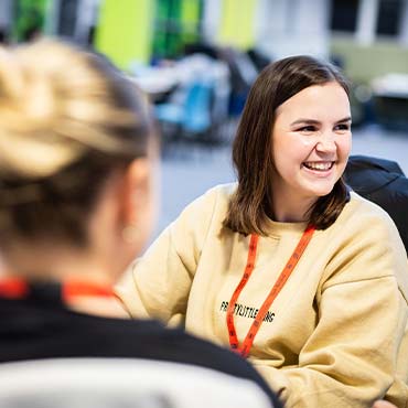 A student chatting to a student support advisor.