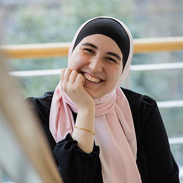 A student smiling at the camera.