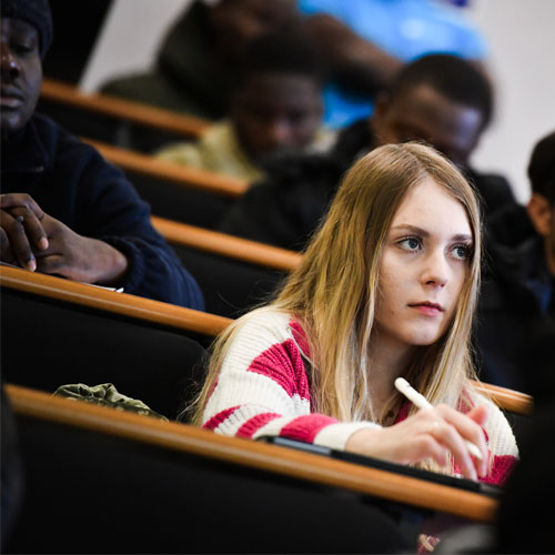 Student in a lecture theatre.