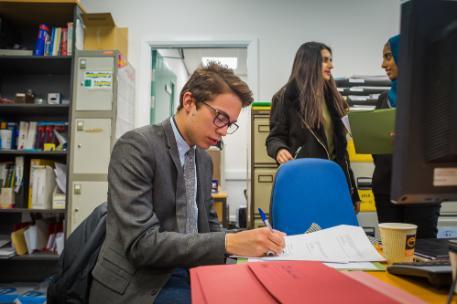 A student in an office gaining work experience