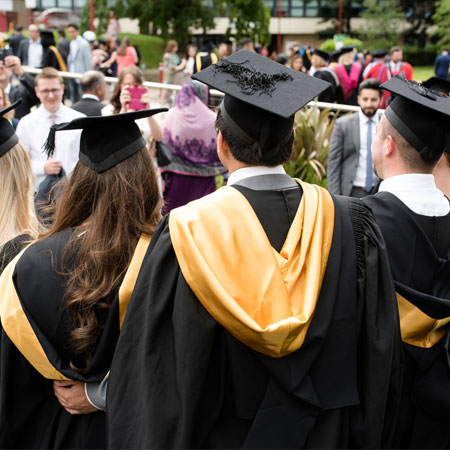 Students are graduation having their picture taken