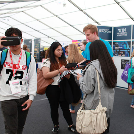 Prospective students talking to a Student Ambassador at a UCAS event