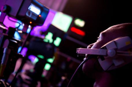 A person operating a camera in a TV studio