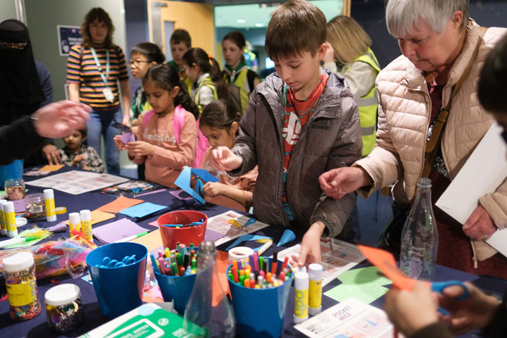 A group of young children doing arts and crafts