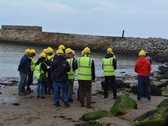 Students wearing high-vis jackets and hard hats in Whitby.