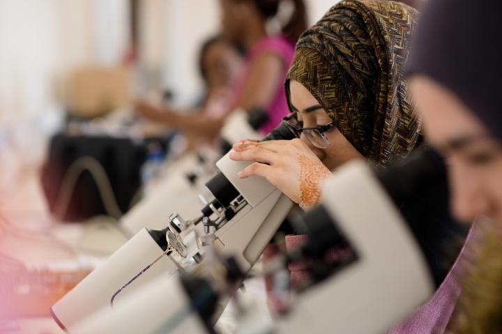 Undergraduate optometry student using equipment.