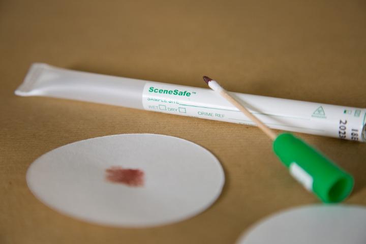 A tube with a biofluid sample swab