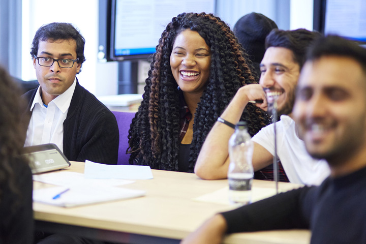 A group of students sitting round a table.