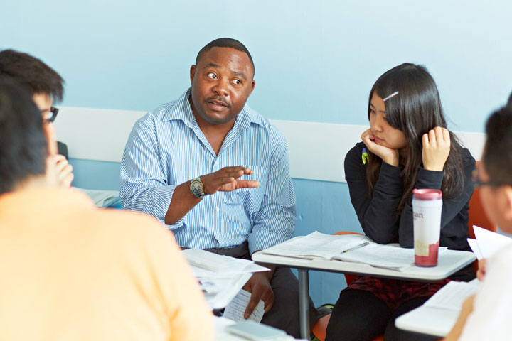 A lecturer talking to students