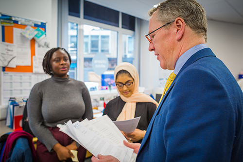 Students getting feedback from a mentor