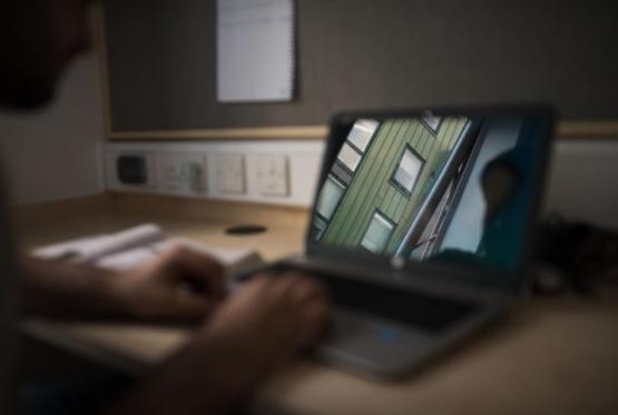 A student working at a laptop computer