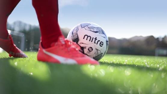 Football player about to kick a football