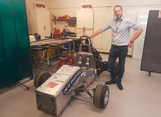 Associate Professor David Bryant with the Team Bradford Racing car