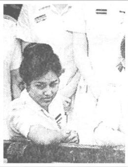 A young woman in a nurses uniform