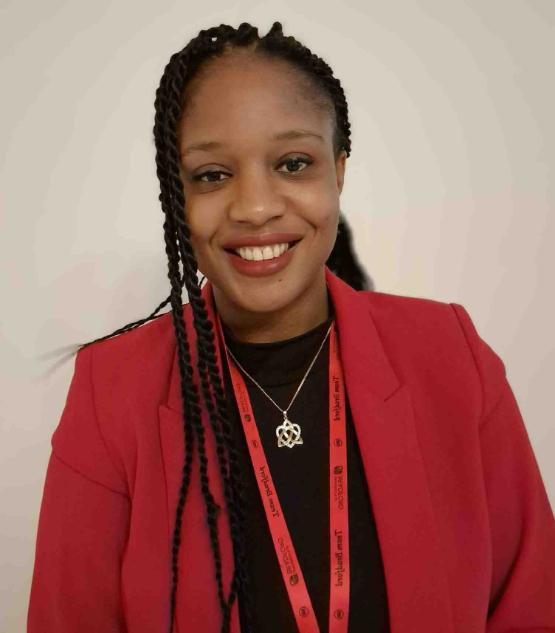 Head and shoulders picture of university staff member smiling