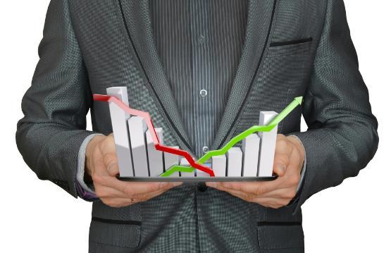 Person holding mock-up of a typical bar chart data graph