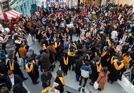 Graduates celebrating in their robes