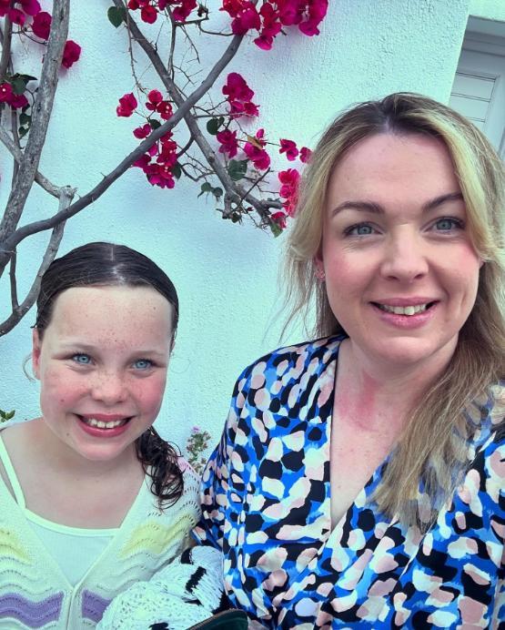 Mother and daughter smiling, Bradford graduate Lisa Varley and her daughter