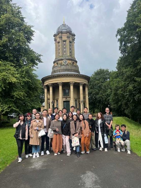 A group of Chinese alumni in a group in Saltaire