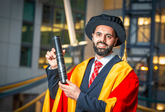 Ishfaq Farooq wearing academic gown