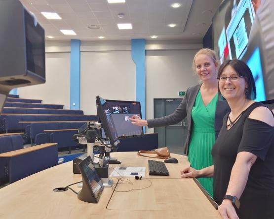 Erica Bellamy and Keren Bielby-Clarke in a lecture theatre