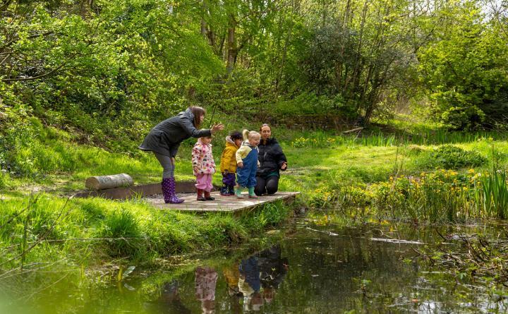 Children with their teachers at the nature reserve next to nursery