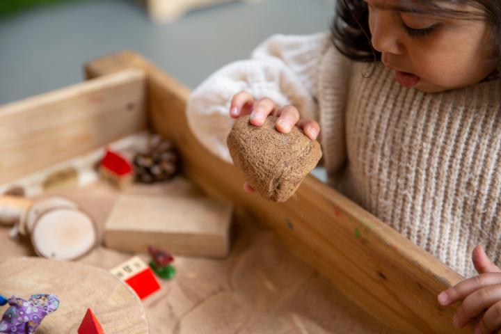 Child playing with sand activity at Nursery 