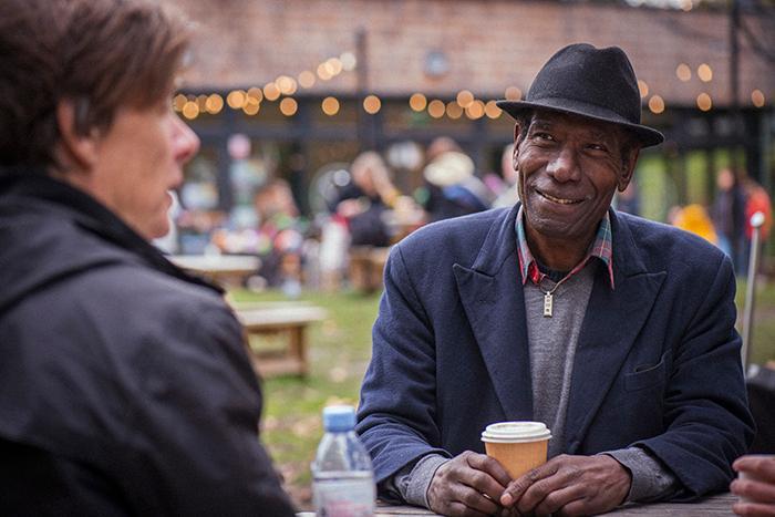 Two people chatting at an outdoor event