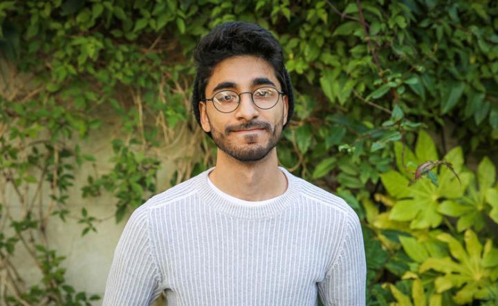 Head and shoulders shot of law graduate Asim Hussain