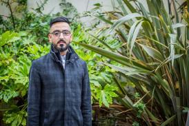 MSc Logistics, Data Analytics and Supply Chain Management graduate Mohammed Abaid in front of plants in Bright Building