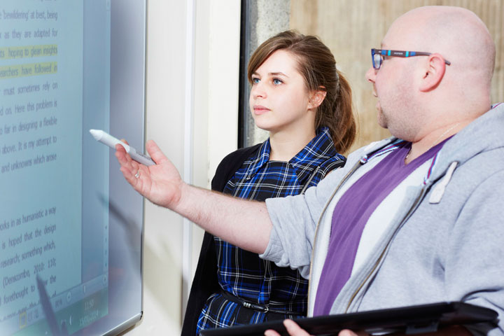 Lecturer talking to a student