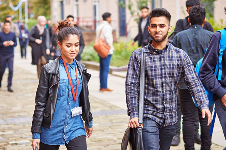 Students walking together outside on campus