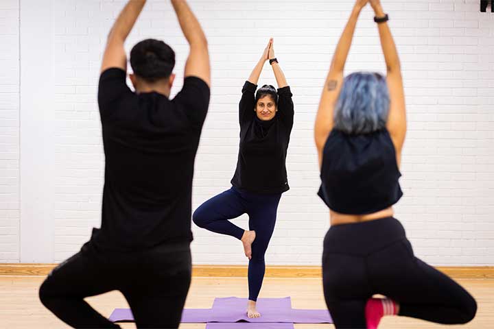 Class on one leg in yoga pose