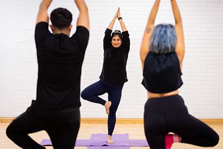 Class on one leg in yoga pose