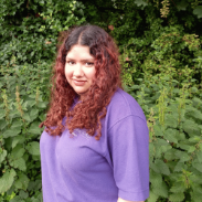 Staff member Alina standing in the nursery garden