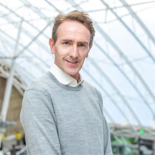 Martin Conway, University Secretary, posing in the atrium of Richmond Building